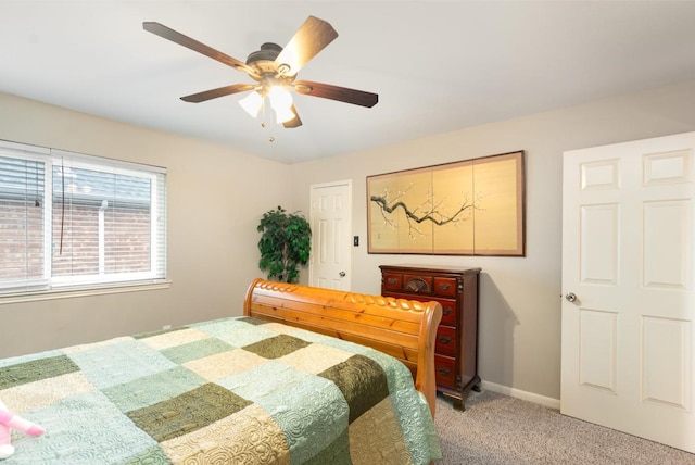 bedroom with a ceiling fan, baseboards, and carpet floors