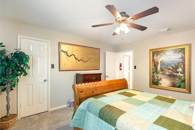 bedroom featuring visible vents, carpet floors, baseboards, and a ceiling fan