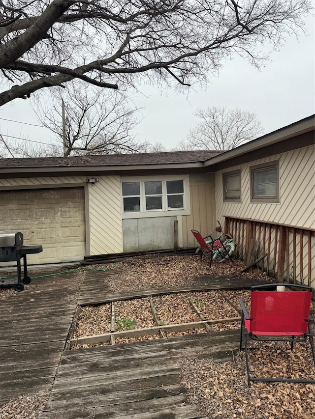 rear view of house with driveway