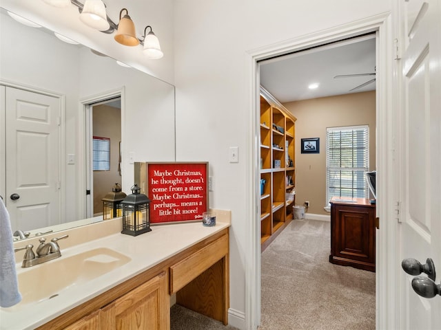 bathroom with vanity and baseboards