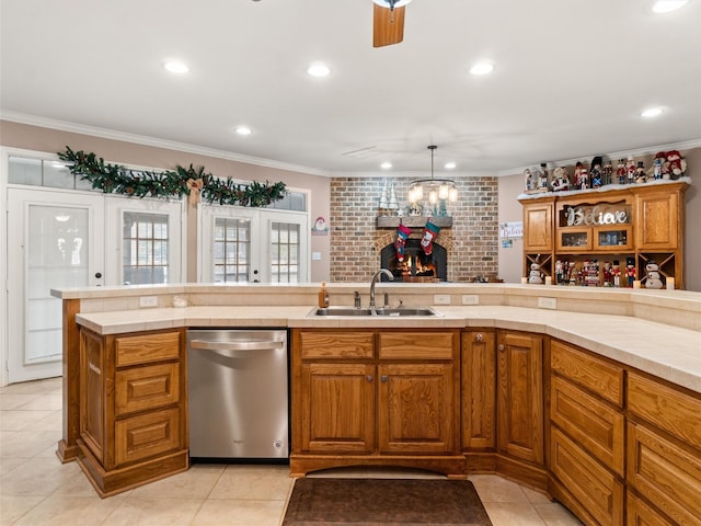 kitchen featuring a sink, dishwasher, ornamental molding, and brown cabinetry