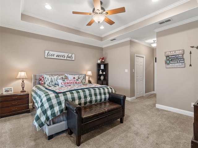 bedroom featuring visible vents, baseboards, crown molding, light colored carpet, and a raised ceiling