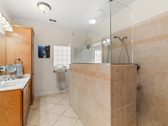 bathroom featuring tile patterned flooring, visible vents, crown molding, walk in shower, and vanity