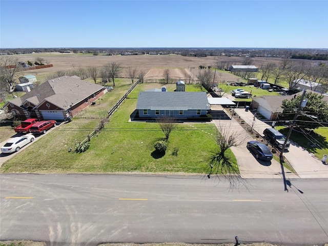 birds eye view of property with a rural view