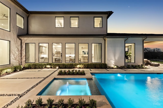 804 Kimball Ct, Allen, TX 75013 - rear view of house with stucco siding, a patio area, and a pool with connected hot tub