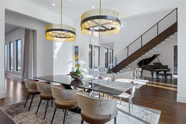 804 Kimball Ct, Allen, TX 75013 - dining room with a chandelier, wood finished floors, stairway, and a towering ceiling