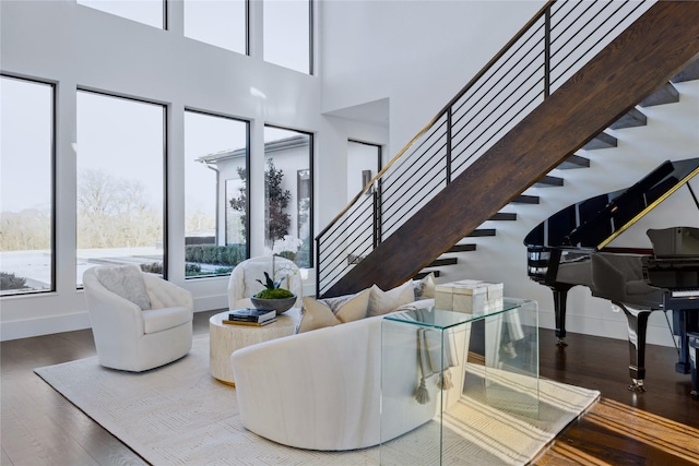804 Kimball Ct, Allen, TX 75013 - living area with wood finished floors, stairway, baseboards, and a high ceiling