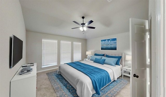 bedroom with baseboards, ceiling fan, and carpet flooring