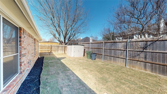 view of yard featuring a fenced backyard