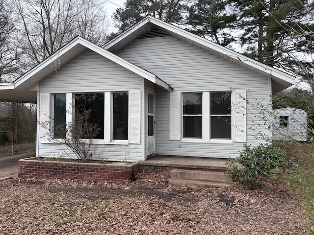 bungalow-style house with a carport