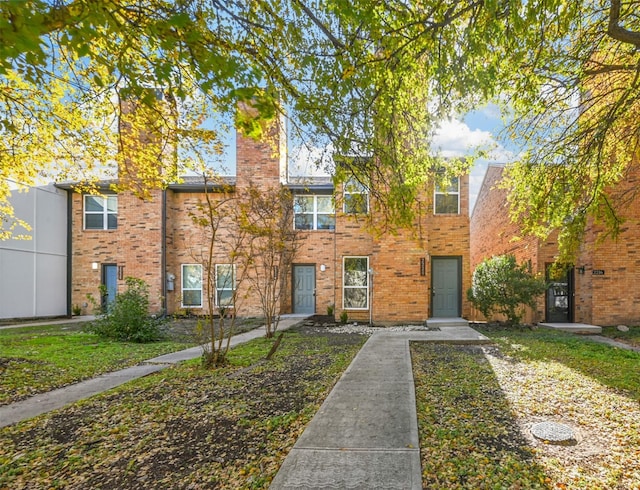 view of property with brick siding