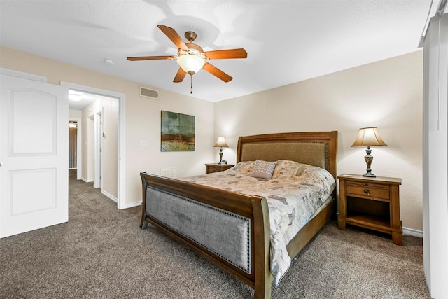 carpeted bedroom with a ceiling fan, baseboards, and visible vents