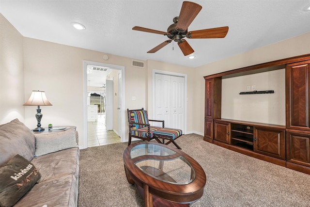 living room with light carpet, visible vents, recessed lighting, and baseboards