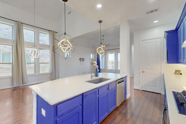 kitchen featuring blue cabinetry, visible vents, dishwasher, and a sink