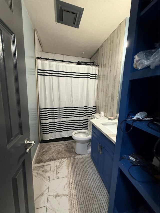 full bath featuring vanity, visible vents, a textured ceiling, toilet, and marble finish floor