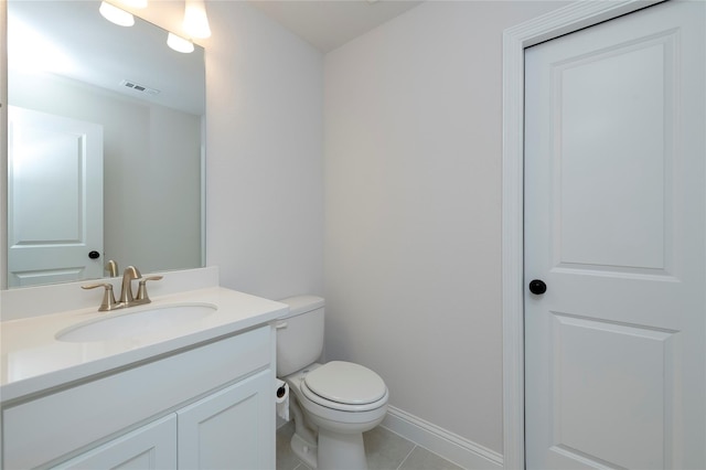 bathroom with visible vents, baseboards, toilet, tile patterned floors, and vanity