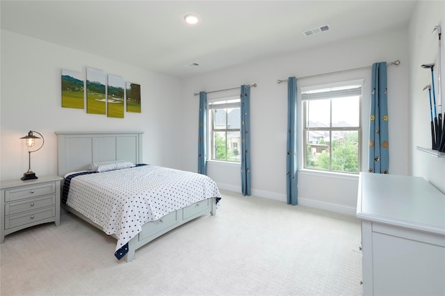 bedroom with recessed lighting, baseboards, light carpet, and visible vents