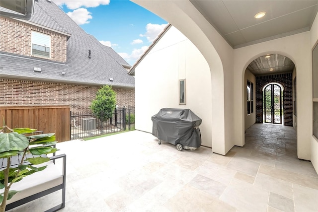 view of patio / terrace with grilling area and fence