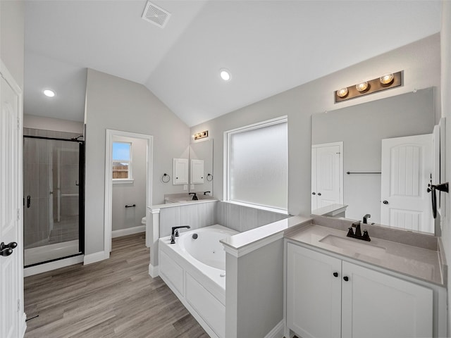 full bath featuring visible vents, a garden tub, toilet, a stall shower, and vaulted ceiling