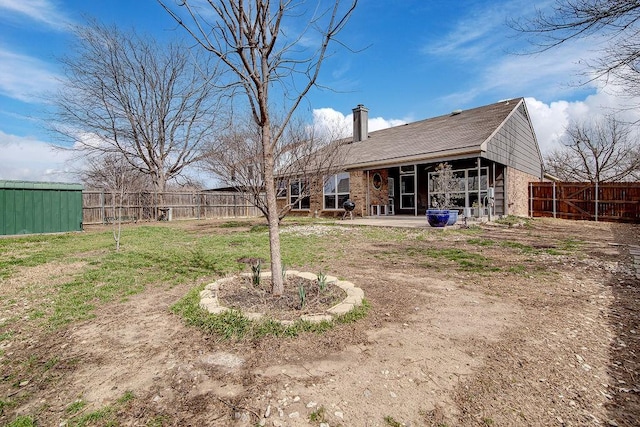 view of yard featuring a patio and fence