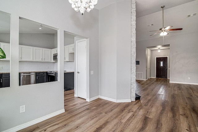 kitchen with white cabinetry, wood finished floors, visible vents, and appliances with stainless steel finishes