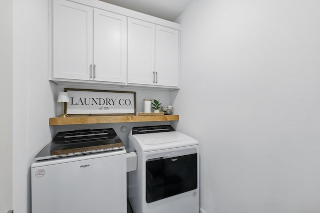 laundry room with cabinet space and independent washer and dryer