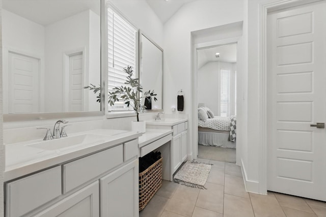 ensuite bathroom featuring tile patterned flooring, vanity, and ensuite bathroom