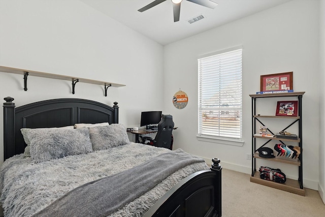 bedroom featuring ceiling fan, light colored carpet, visible vents, and baseboards