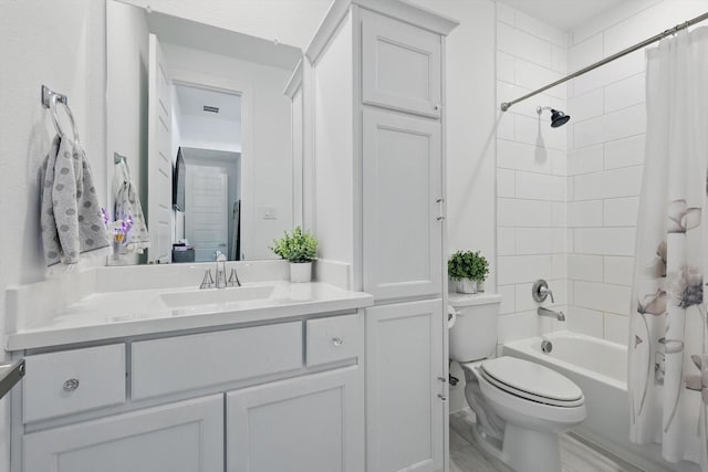 bathroom with toilet, shower / bath combo, and vanity