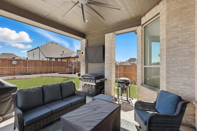 view of patio with a grill, an outdoor hangout area, a fenced backyard, and ceiling fan