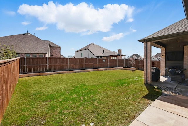 view of yard with a fenced backyard and a patio