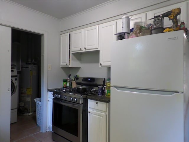 kitchen with gas water heater, ornamental molding, freestanding refrigerator, white cabinets, and gas stove