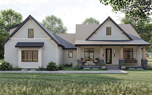 modern farmhouse featuring brick siding, covered porch, and a front yard