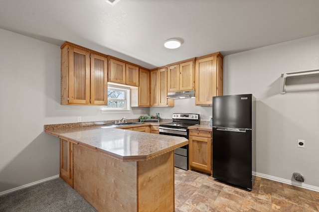 kitchen with a peninsula, a sink, stainless steel electric range oven, freestanding refrigerator, and under cabinet range hood
