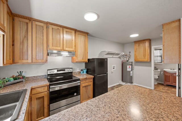 kitchen featuring a sink, stainless steel electric range, freestanding refrigerator, water heater, and under cabinet range hood