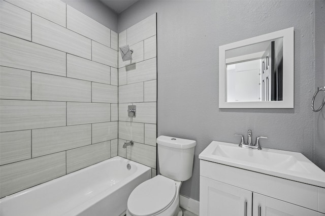 full bathroom featuring toilet, shower / washtub combination, vanity, and a textured wall