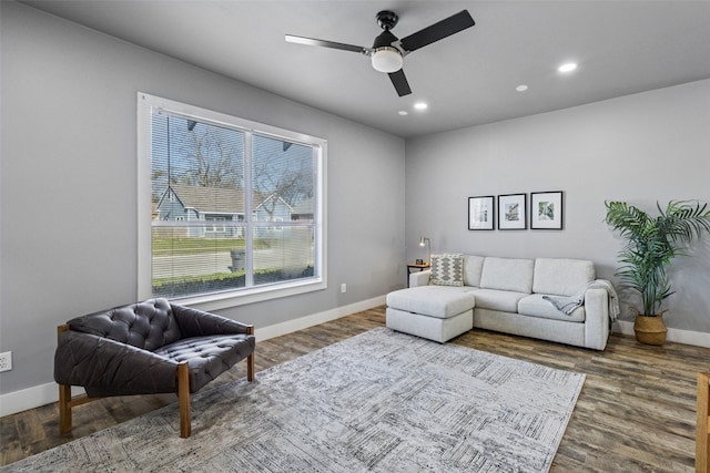 living area with recessed lighting, ceiling fan, baseboards, and wood finished floors