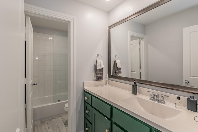 bathroom with vanity, toilet, and tub / shower combination