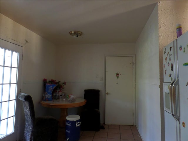 dining space with light tile patterned floors