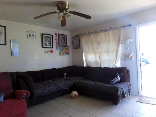 living room featuring light tile patterned floors and a ceiling fan