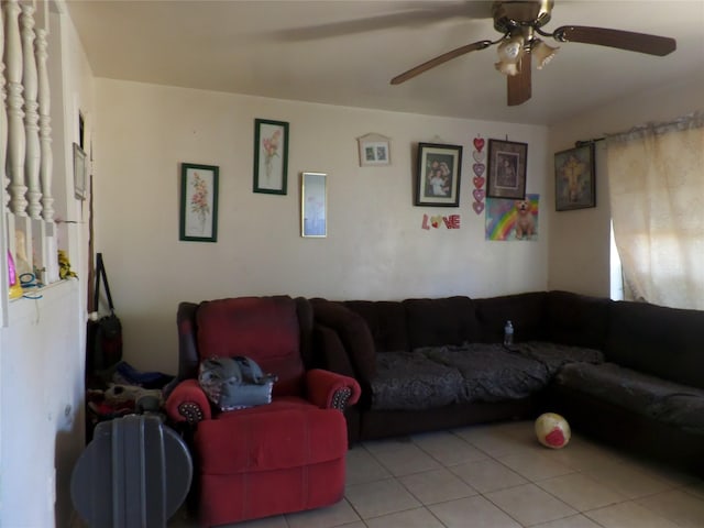 living area with tile patterned flooring and a ceiling fan