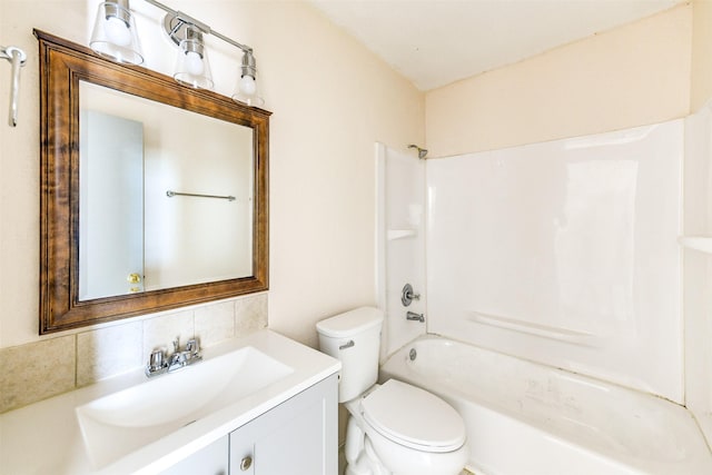 full bathroom with shower / bath combination, backsplash, vanity, and toilet