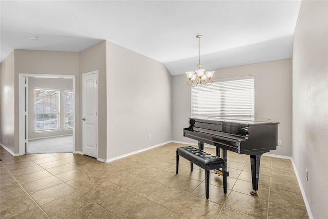 living area with baseboards, lofted ceiling, a notable chandelier, and tile patterned flooring