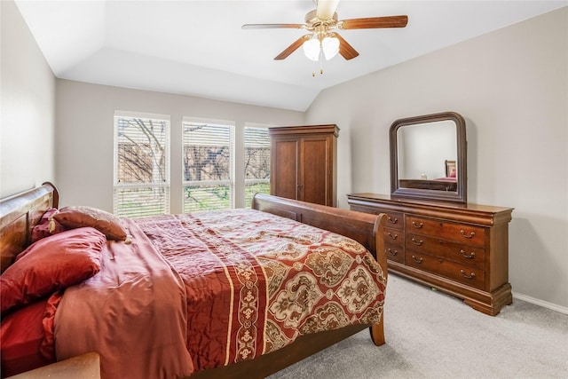 bedroom with lofted ceiling, carpet, baseboards, and ceiling fan