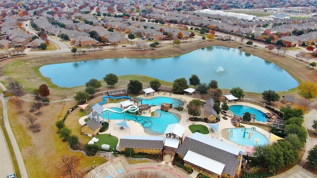 birds eye view of property featuring a water view and a residential view