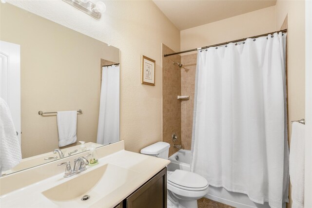 full bathroom featuring vanity, toilet, and shower / tub combo