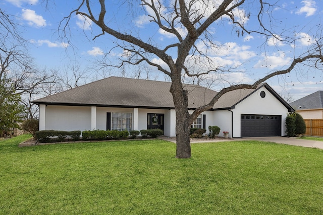 view of front facade with fence, concrete driveway, a front yard, a shingled roof, and a garage