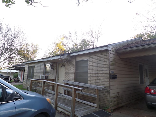 exterior space featuring brick siding