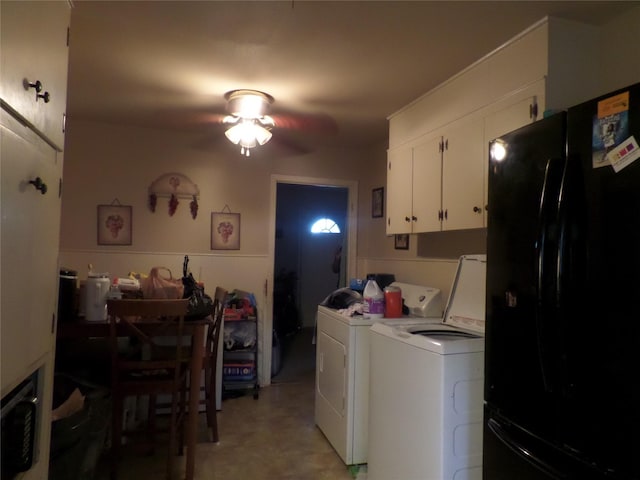 clothes washing area featuring ceiling fan, cabinet space, and washer and clothes dryer