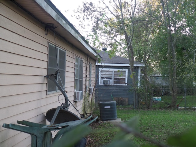 view of side of property with central AC